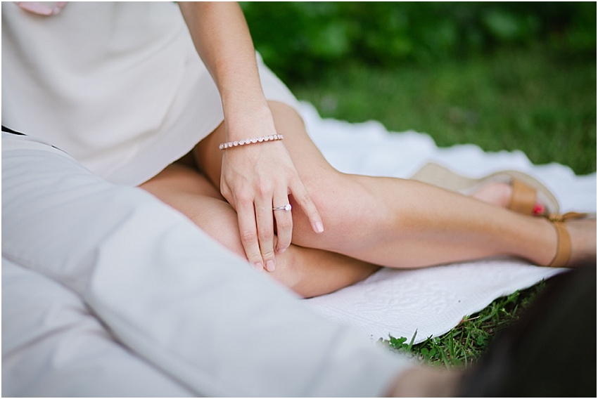 alabama spring engagement session photo with a round solitaire diamond engagement ring